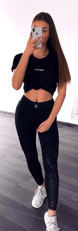 Black crop-top shirt and black jeans.