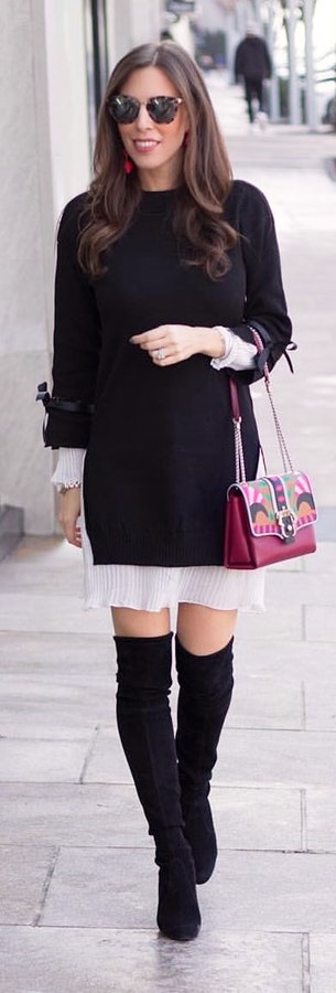 Black long-sleeved dress holding purple shoulder bag. Pic originally posted by elleoquentstyle