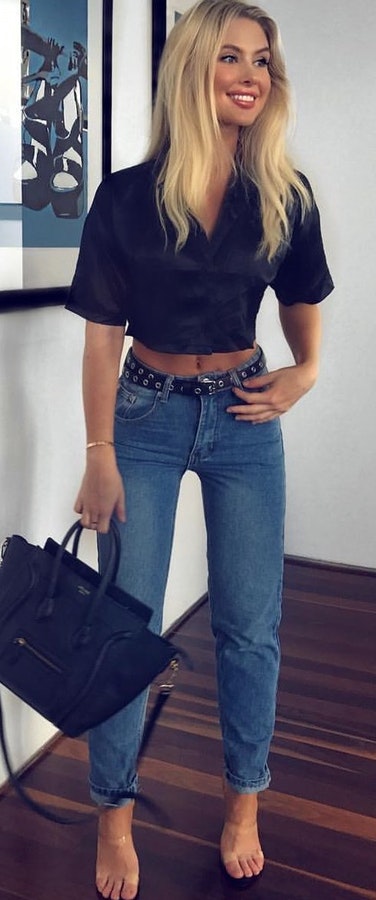 Black top + Blue ankle length jeans + Nude heels + Black leather bag. Pic originally posted by isabella_gray