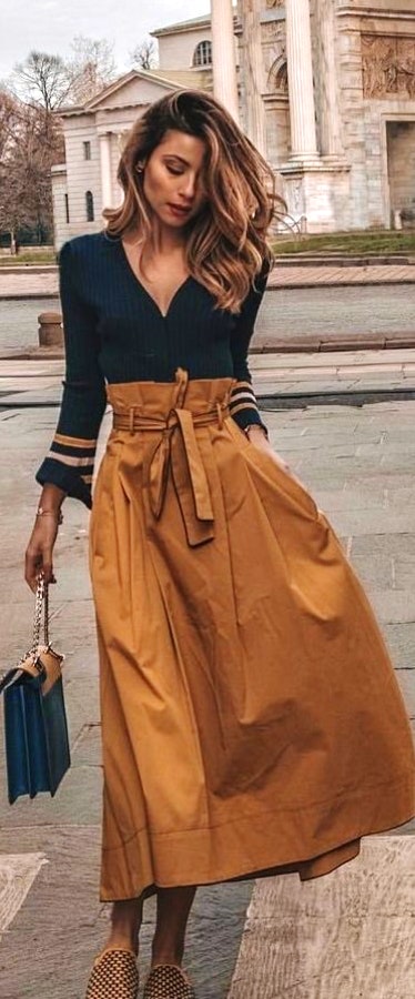 Black v-neck long-sleeved tops with brown long skirt. Pic originally posted by ilovestreetstyle