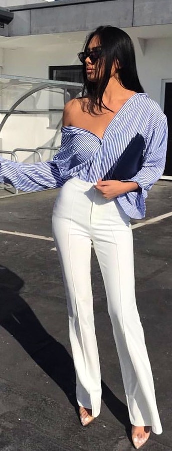Blue long-sleeved dress and white pants. Pic originally posted by charlotteemilysanders