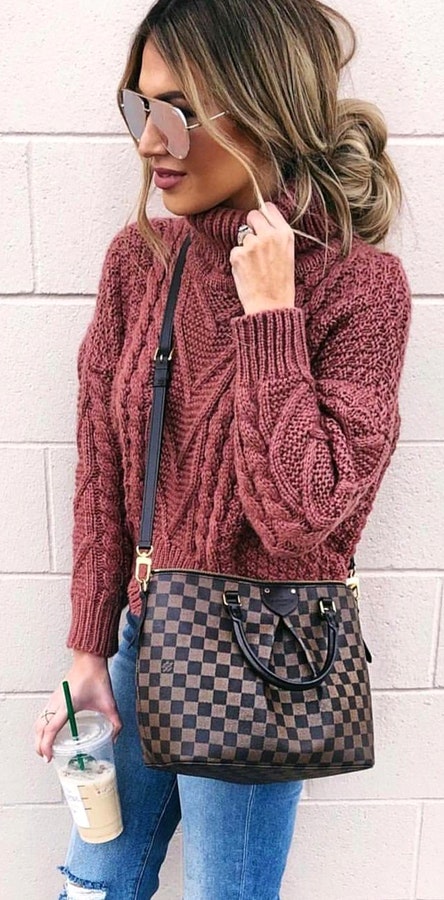 Pink sweater and Damier Ebene Louis Vuitton 2-way handbag.