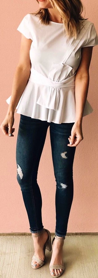 White cap-sleeved peplum top, distressed blue jeans and pair of open-toe heeled sandals outfit.