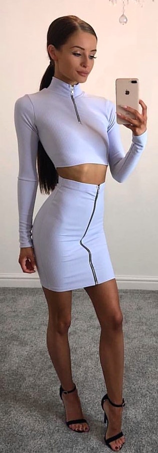 White long-sleeved 2-piece mini dress + Black high heels. Pic originally posted by talliahroseuk