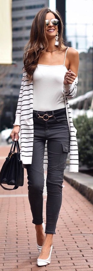 White spaghetti strap with black pants and 2-way bag.