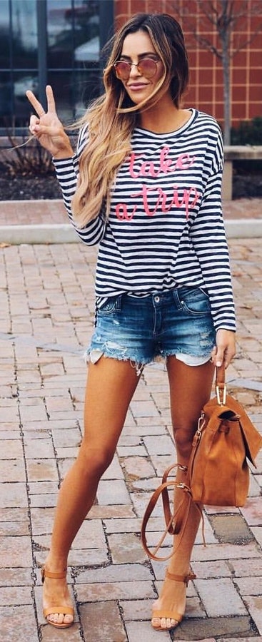Black and white striped scoop-neck sweater and distressed blue denim short shorts.