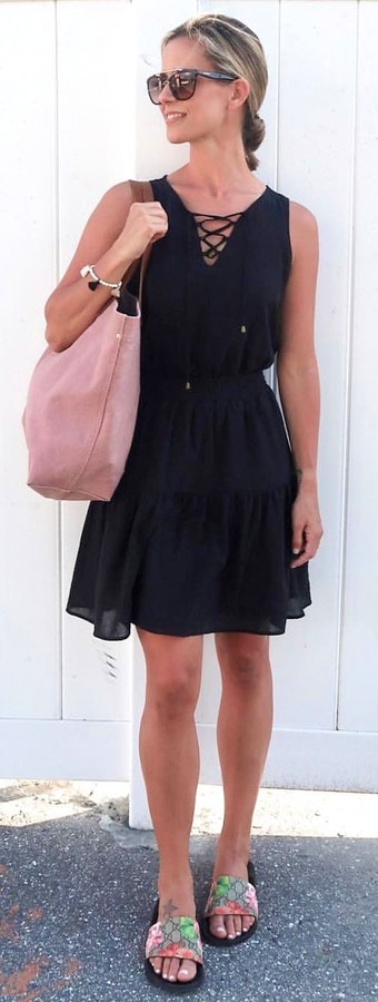 Black sleeveless mini dress.
