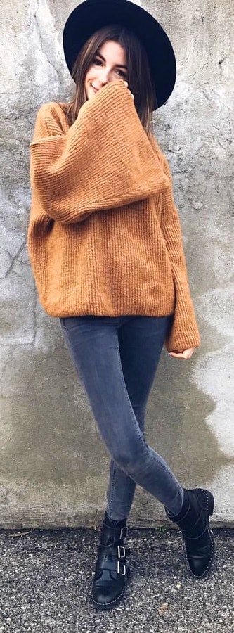 Brown sweater and gray skinny jeans outfit.