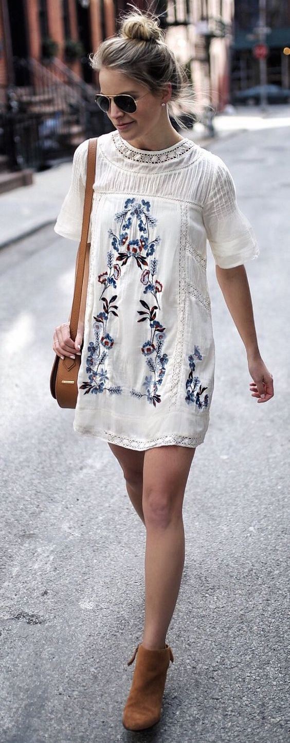 Embroidered dress brown boots bag.