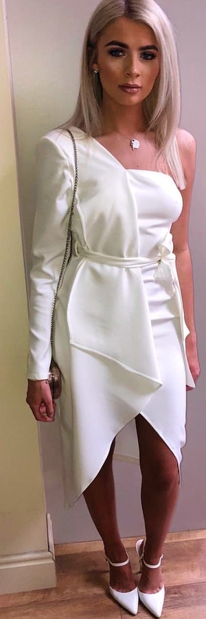 White 1-shoulder long-sleeved dress.
