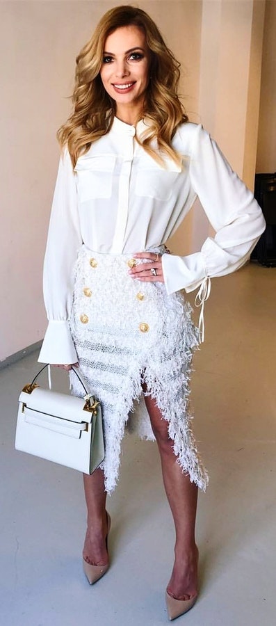 White long-sleeved blouse and fleece side slit skirt.