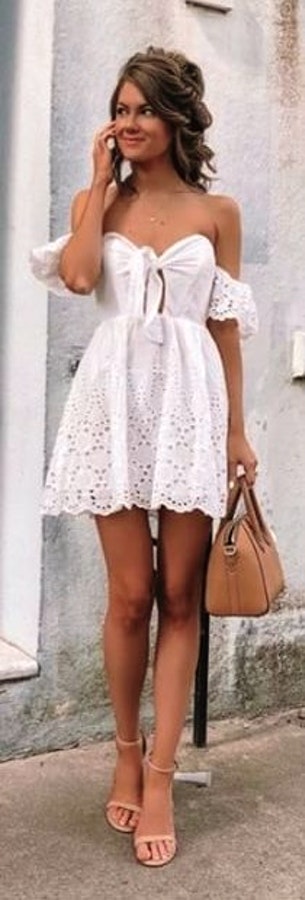 White tube dress with handbag.