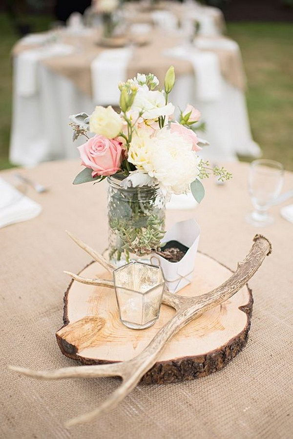 Antler and Flowers in Jars on a Wood Round Centerpiece