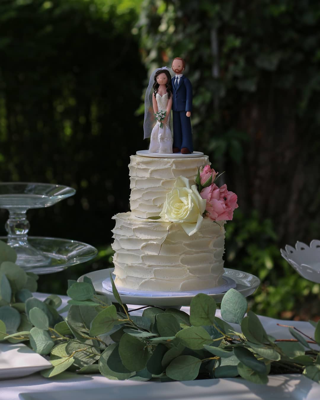 Classic textured buttercream mini wedding cake with dessert table
