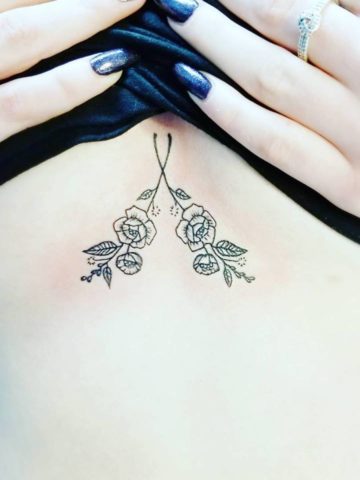 Small flowers sternum tattoo. Pic by josmoontattoo