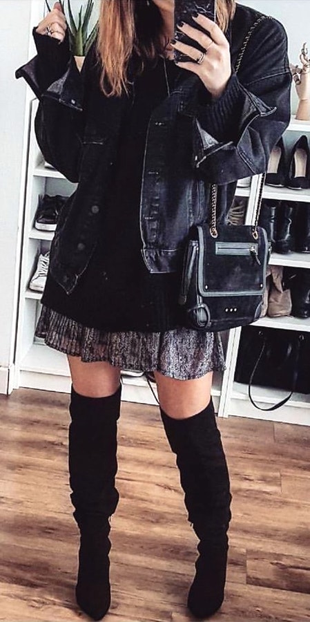 Women's black button-up jacket, grey mini skirt, and black knee high boots outfit.