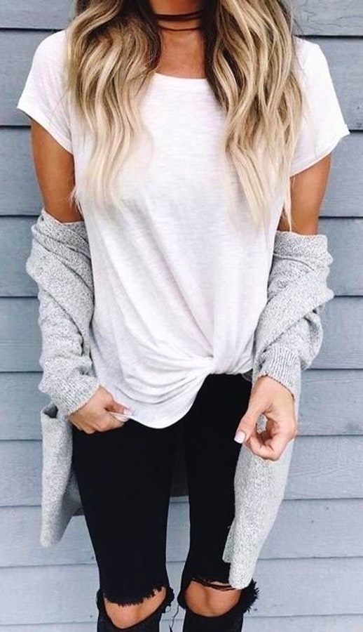 Women's white cap-sleeved shirt with grey cardigan and black pants outfit.