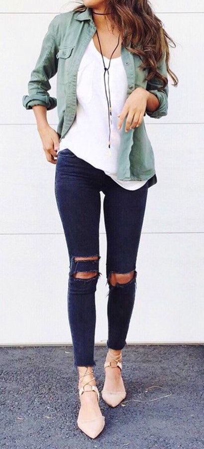 Women's white scoop neck top, green button-up sports shirt and distressed black pants.