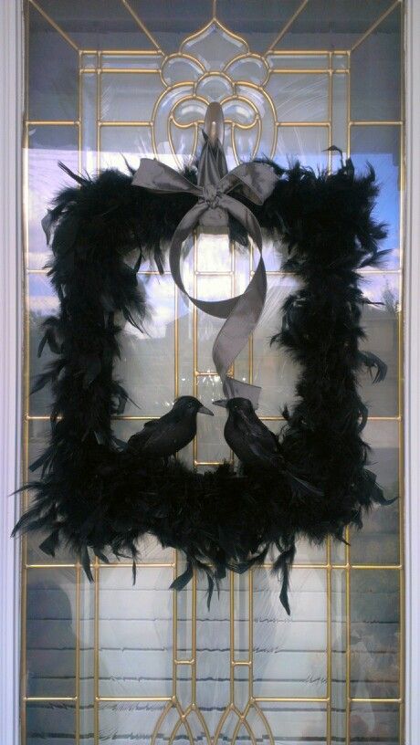 Black frame boa feather glued on add ravens from dollar store and silver gray ribbon.