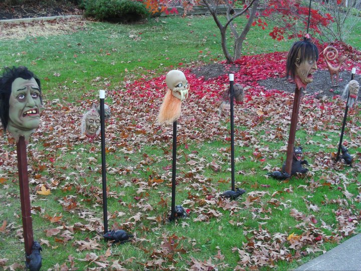 Front yard heads on stakes and shrunken heads.