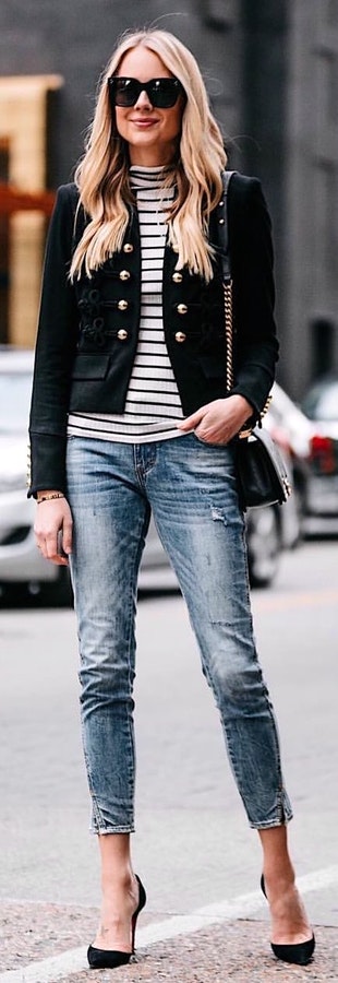 Gray and black striped shirt, black jacket, and blue denim jeans with pair of black pumps.