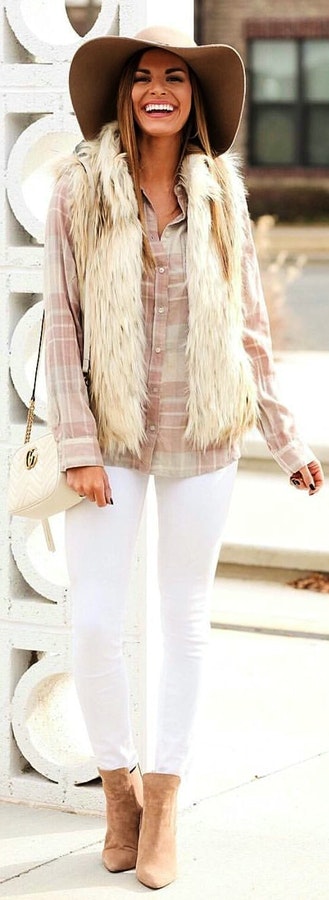 Grey button-up long-sleeve collared top and white pants.