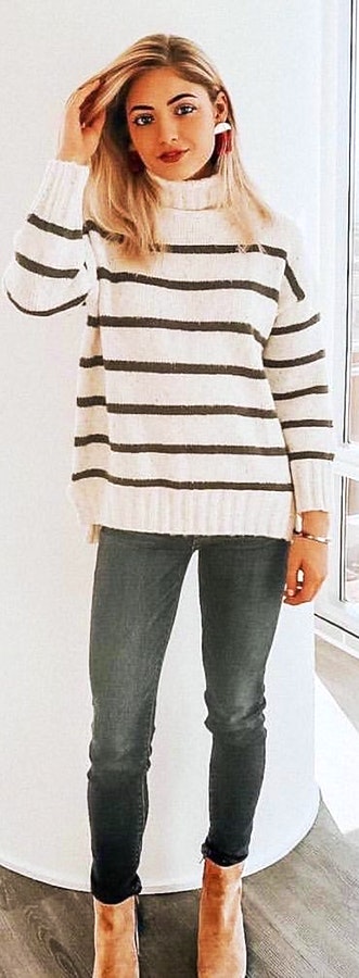 White and grey striped sweater and grey pants outfit.