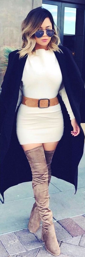 White bodycon mini dress, gray thigh boots, and black coat outfit.