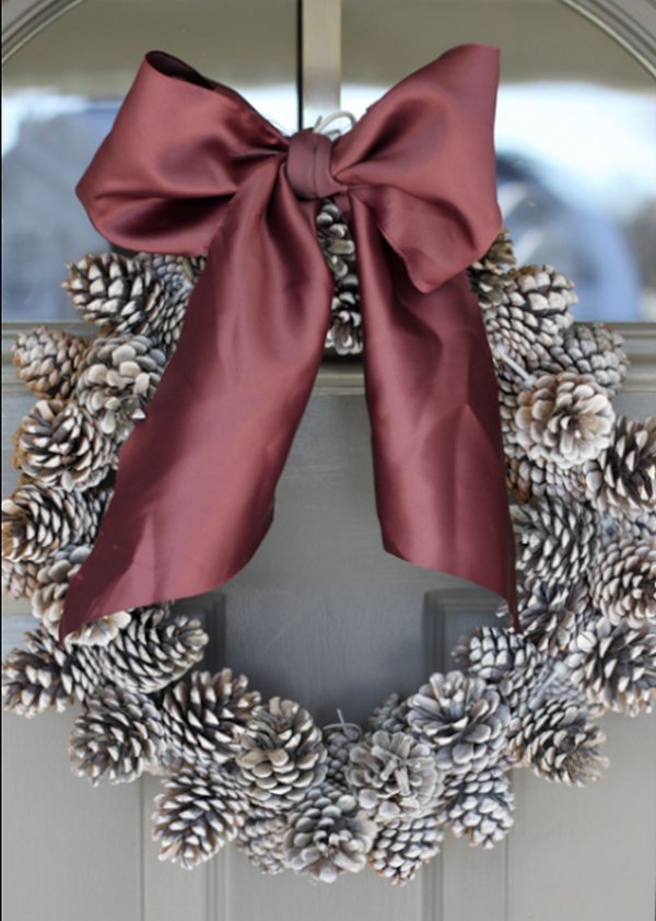 Create a rustic pinecone holiday wreath.