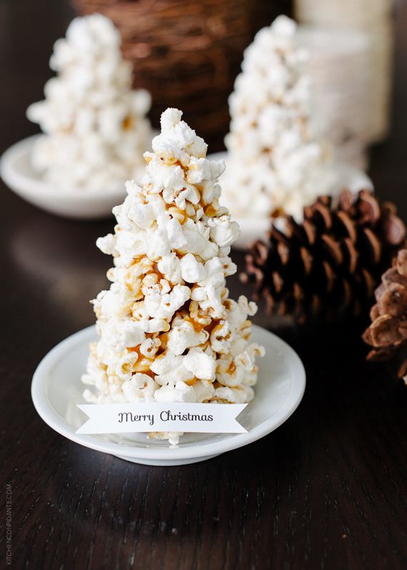 Edible popcorn Christmas trees can be created and placed on the dinner table.
