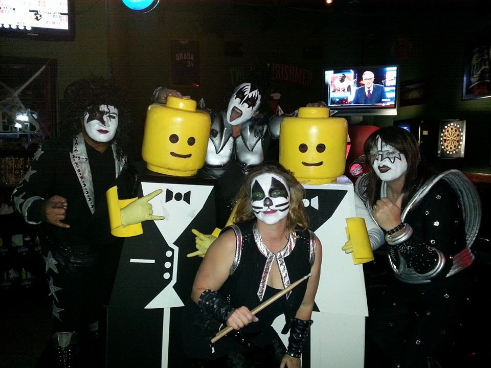Lego men over Kiss at a Halloween costume contest.
