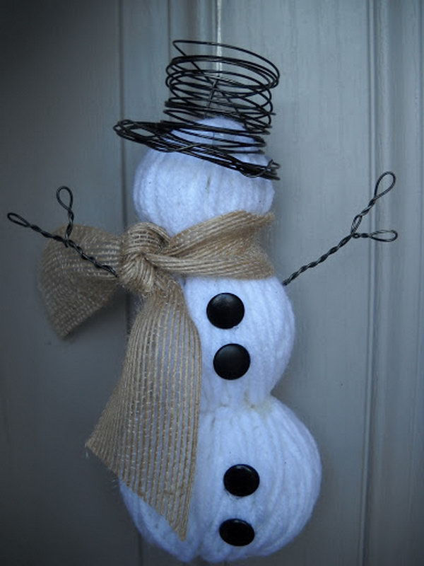 Make a snowman with yarn wrapped foam balls.