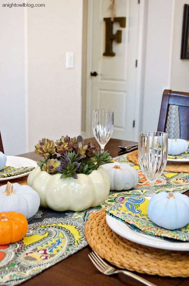 Pumpkin succulent centerpieces for a bright and cheery tablescape.