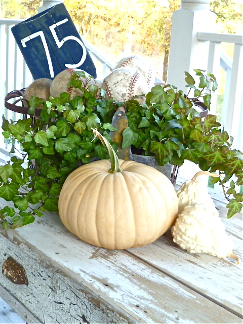 75 sign is an old paddle, Add some pumkin and baseball to make a beautiful porch.