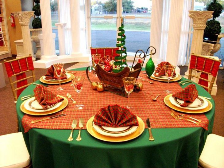 Christmas Centerpiece with Green Christmas Tree and Ornaments in Sleigh.