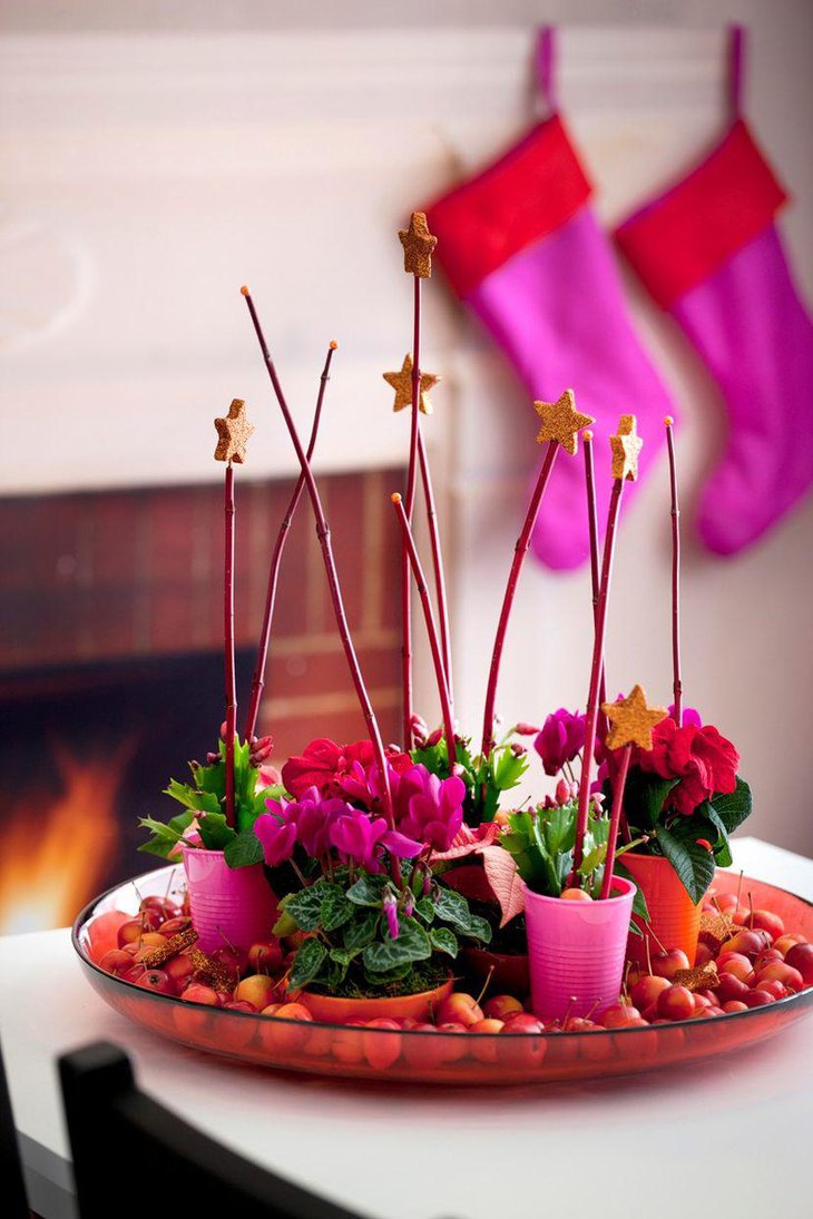 Creative Centerpiece Idea with Red and Pink Floral Arrangements on a Glass Dish.