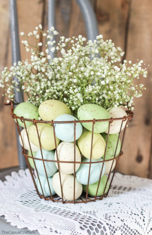 Pastel, speckled eggs, copper baskets.