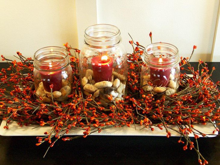 Stone and Candle Filled Jars on a Bed of Faux Twigs.