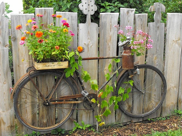 Fence-Mounted Rusty Vintage Bike.