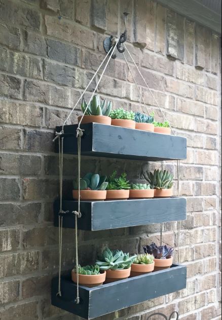 DIY hanging planter to place clay pots for herbs.