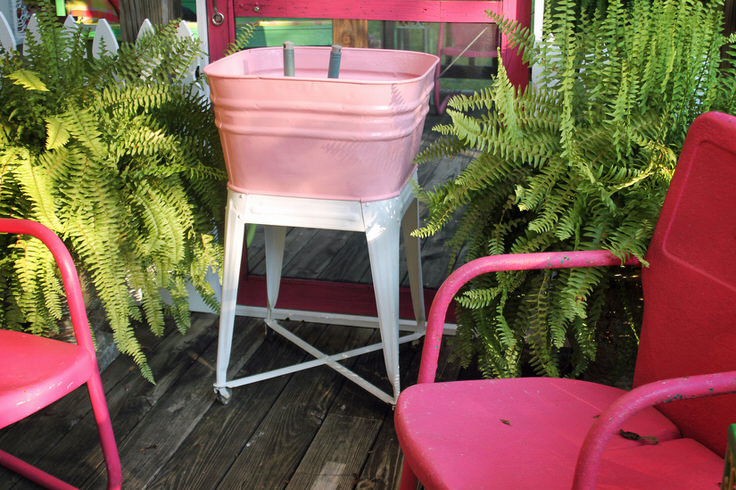 DIY potting stand from an old washtub.