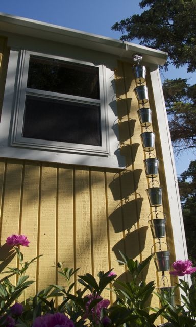 Downspout rain chains with galvanized steel buckets and chains.