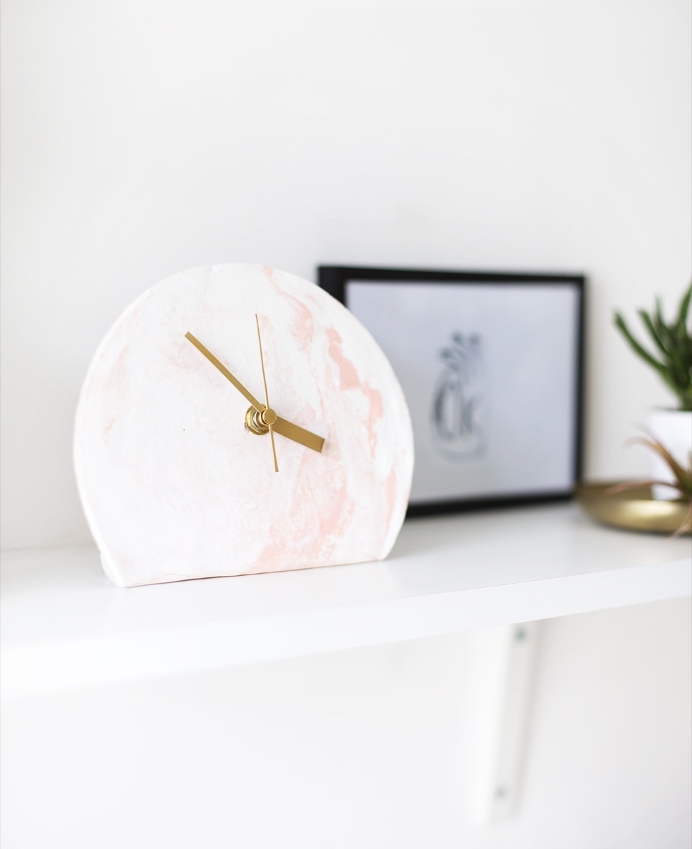 Marbled standing clock is so unique.