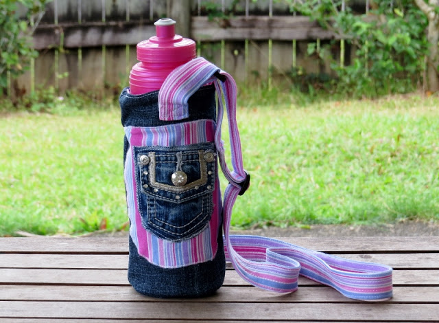 Create a funky water bottle carrier using an old pair of jeans and some pretty fabric.