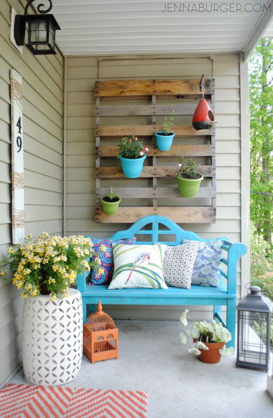 Flowerpots along with the colorful bench.