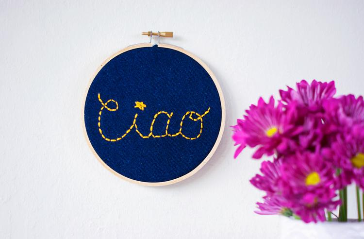Turn old jeans into this charming embroidered wall sign.