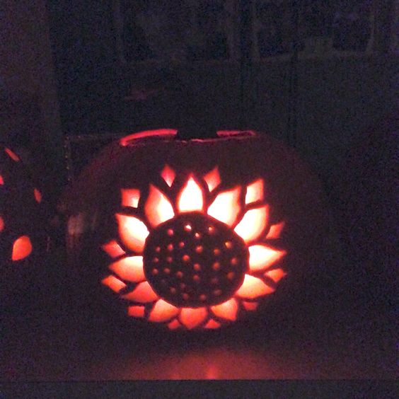 Sunflower pumpkin carving.