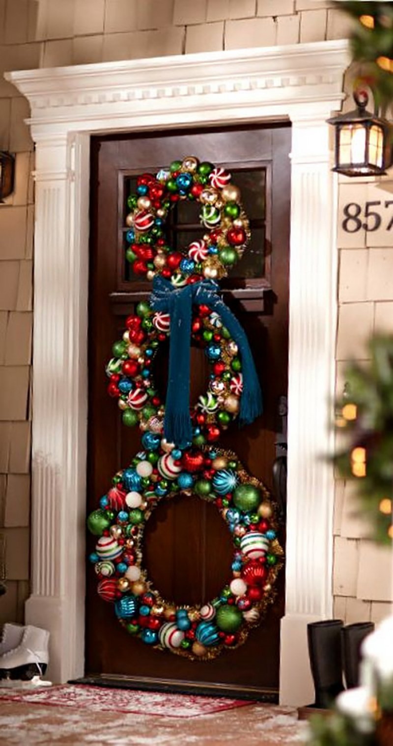 A Snowman Silhouette Made Of Wreaths.