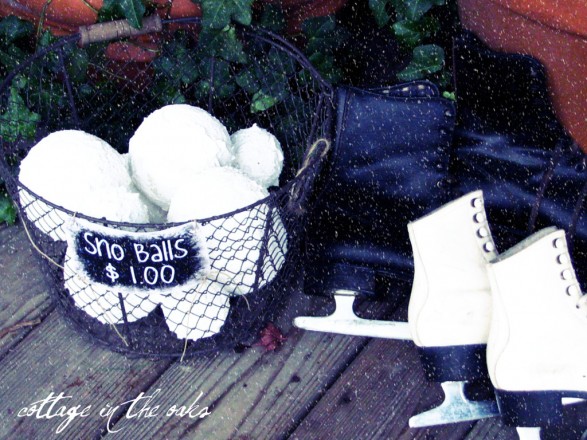 Cute DIY snowballs placed in basket on front porch.