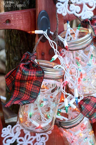 Fill mason jars with mini lights and hang them.